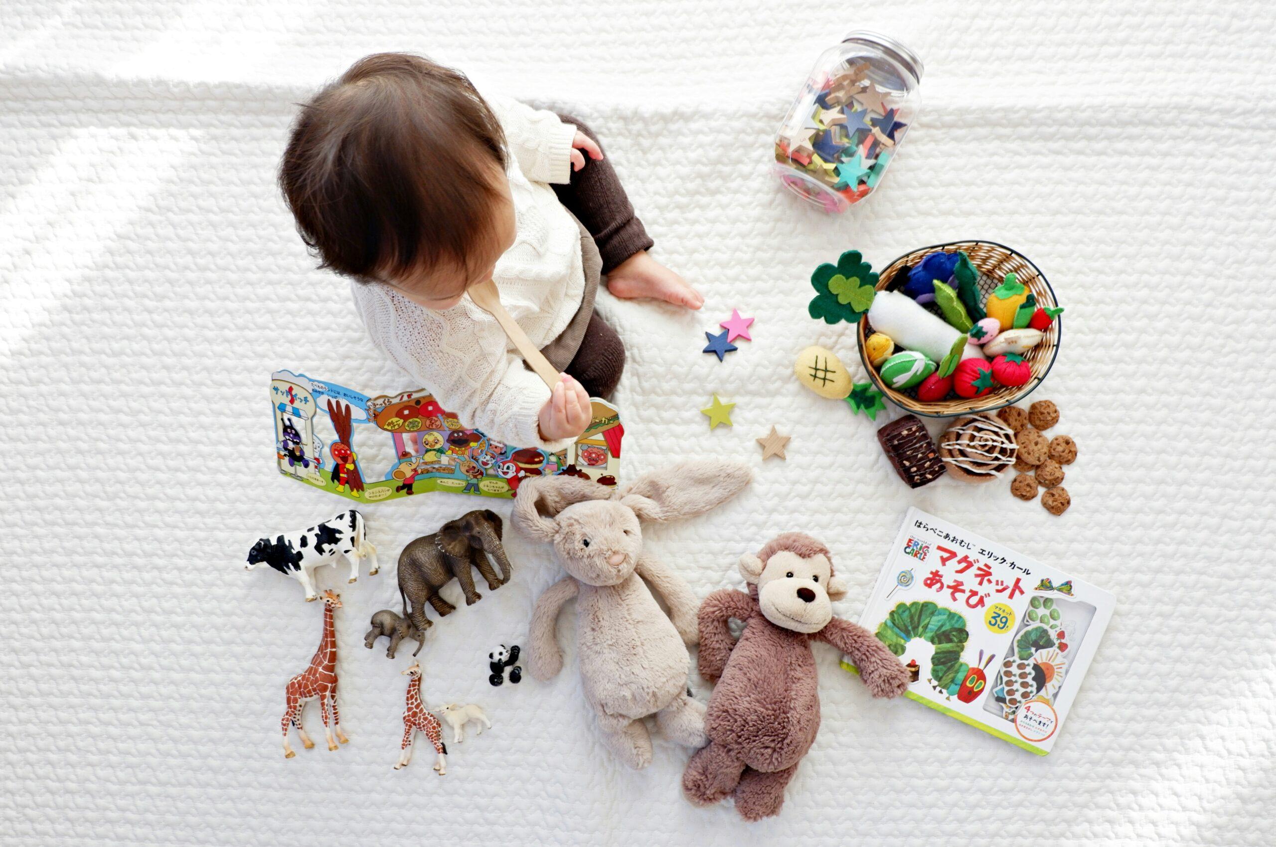 toddler playing with sensory toys